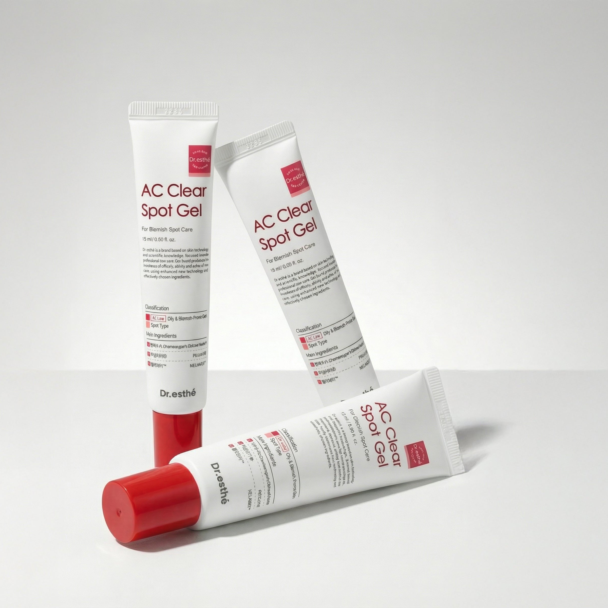 Three tubes of AC Clean Spot Gel on a light gray background