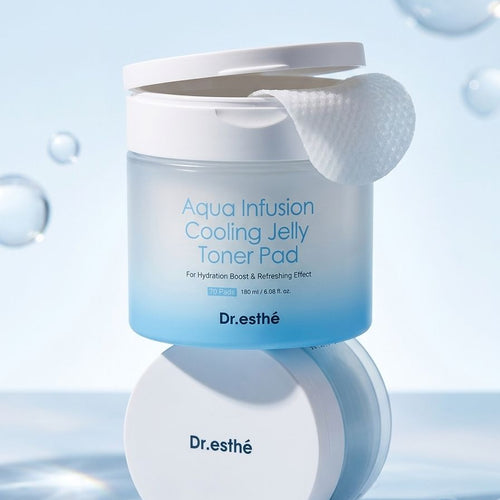 Dr. esthé Aqua Infusion Cooling Jelly Toner Pad shown in a white jar with a blue gradient label, with a cotton pad pulled out of the top, set against a light blue background with floating water droplets.