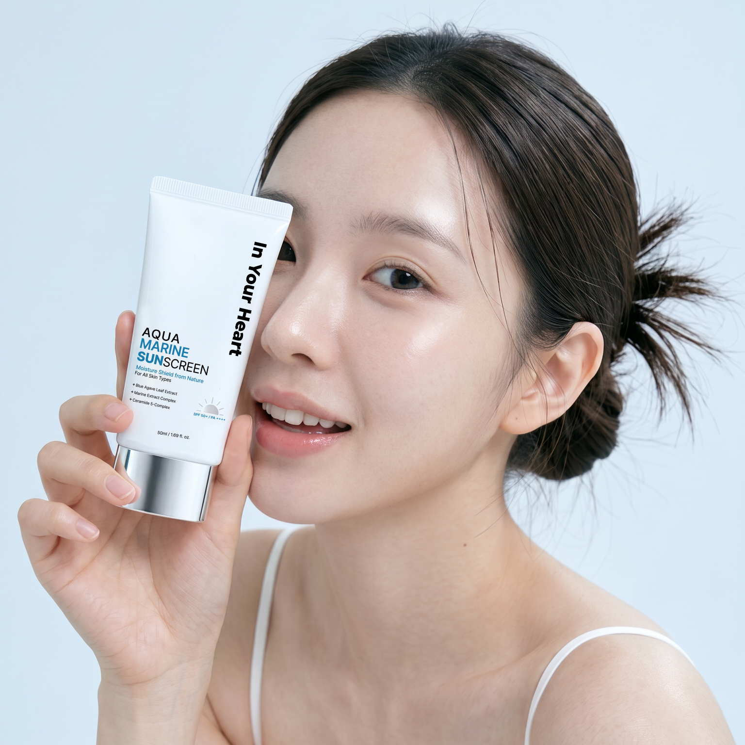 In Your Heart Aqua Marine Sunscreen and young lady