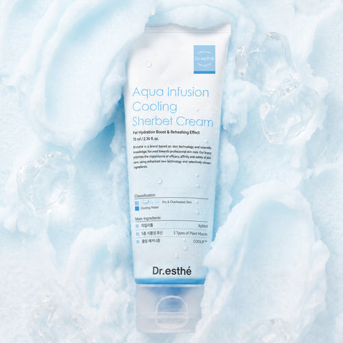 A tube of Dr. esthé Aqua Infusion Cooling Sherbet Cream lies on a textured, icy white background with light blue shadows and water droplets.