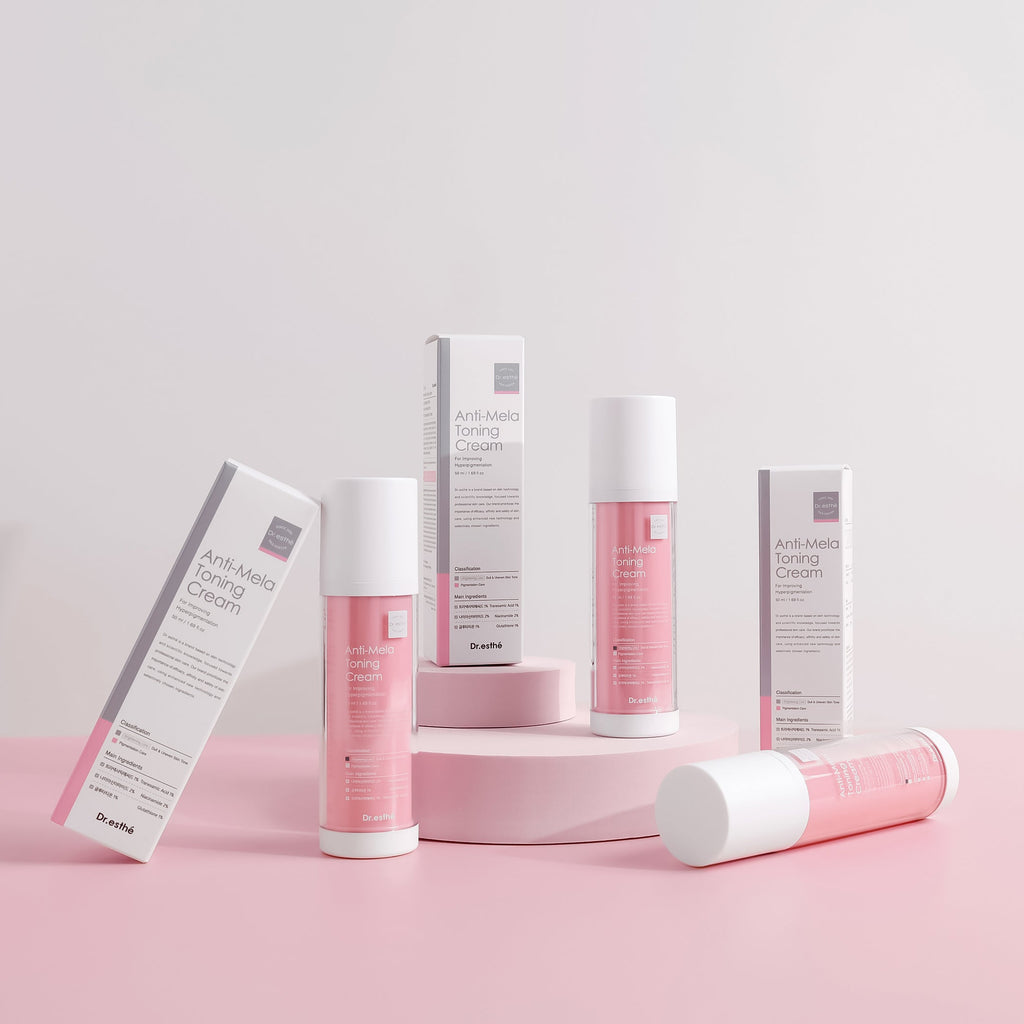 Cosmetic products with pink and white packaging on a light pink background