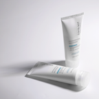 Two tubes of facial moisturizers Eclat du teint Ocean Waterful Cream on a light gray background