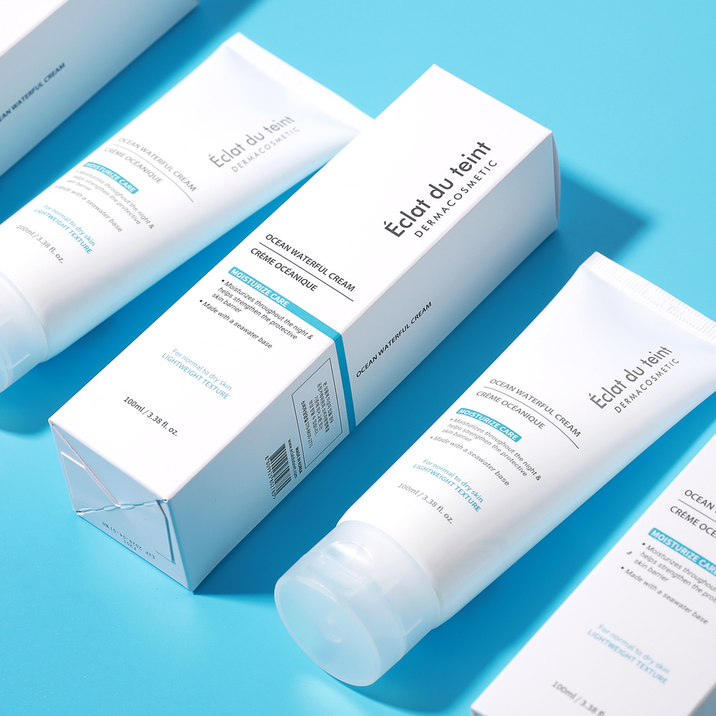 Cosmetic product and packaging labeled 'Eclat du teint Ocean Waterful Cream' moisturizer  on a blue background