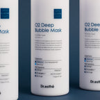 Three bottles of Dr. Esthe O2 Deep Bubble Mask on a blue background