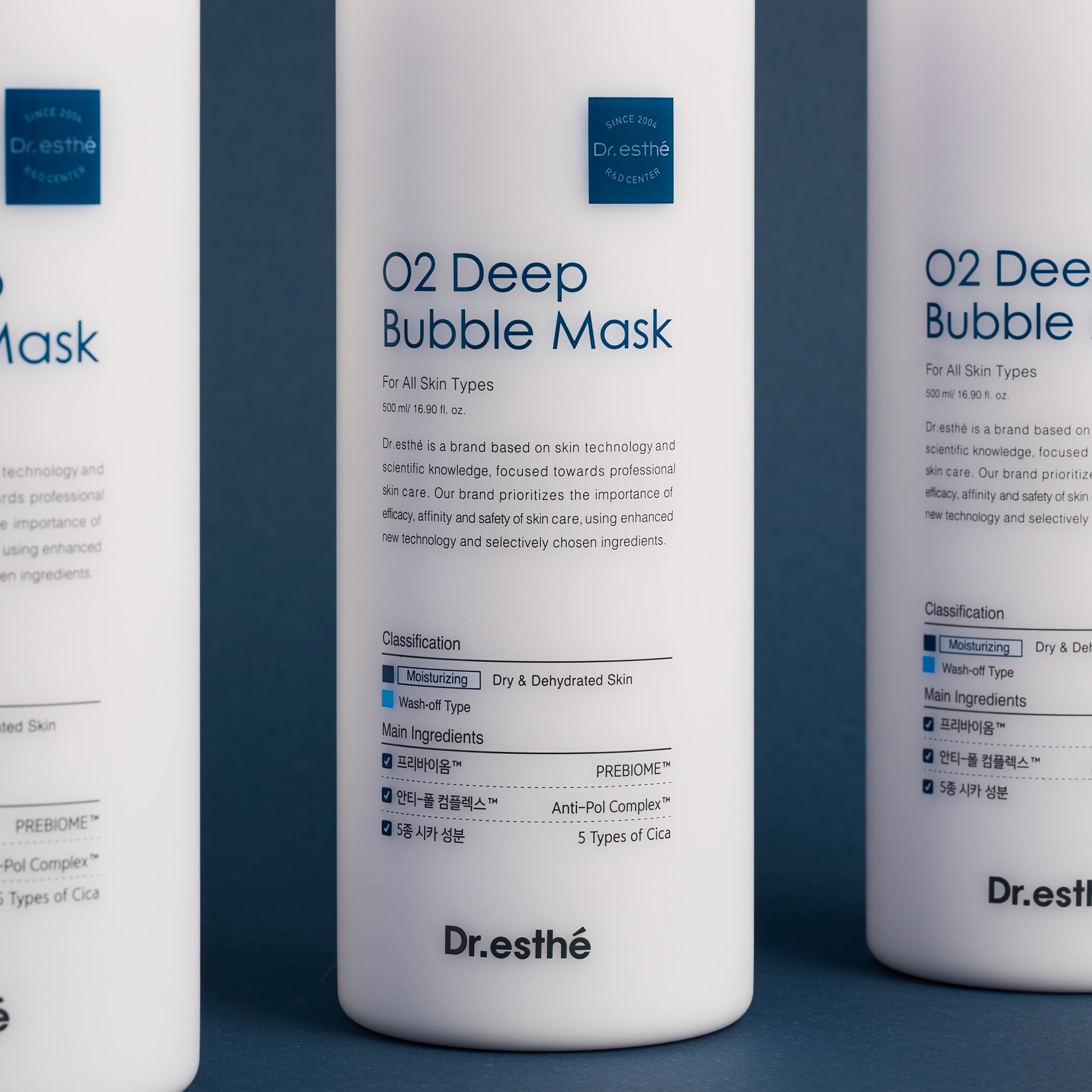 Three bottles of Dr. Esthe O2 Deep Bubble Mask on a blue background